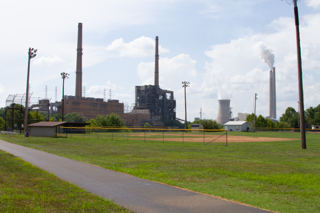 View of closed Philip Sporn power plant and operating Mountaineer power plant from a baseball field near Racine Ohio.