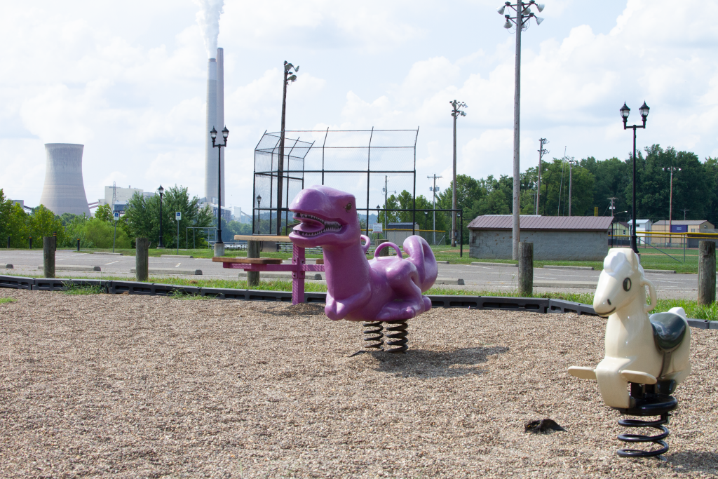 Playground with power plant in background